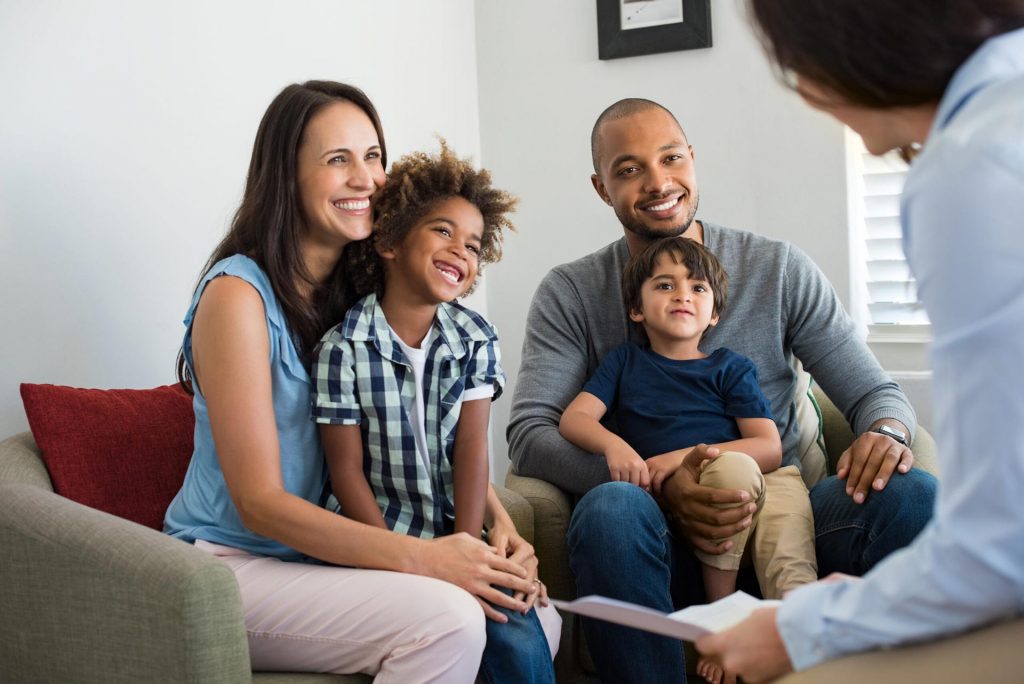 Safeguarding and Child Protection, young. family having conversation with therapist.