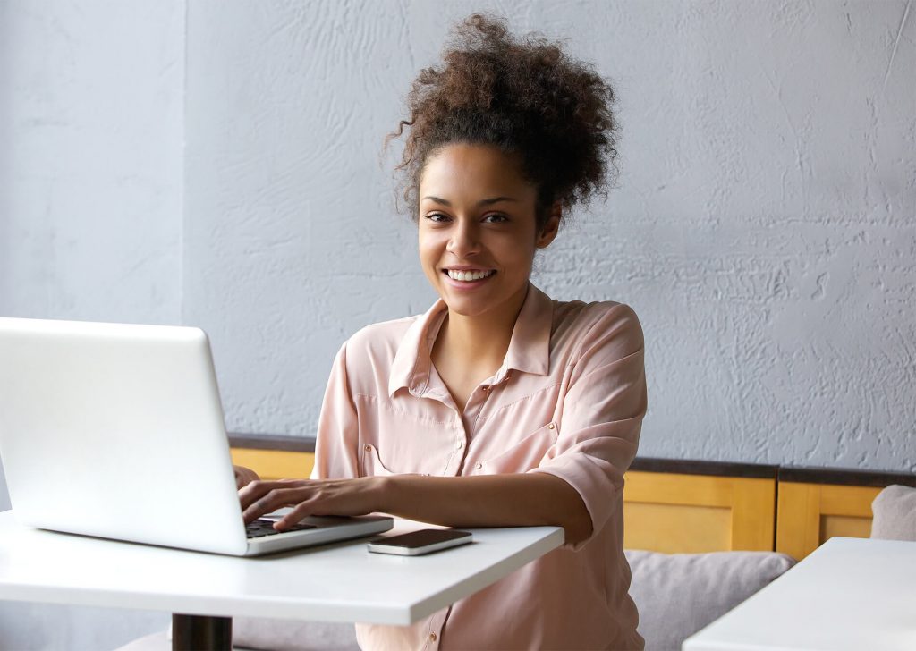 Report and Record Writing, young woman writing report on laptop.