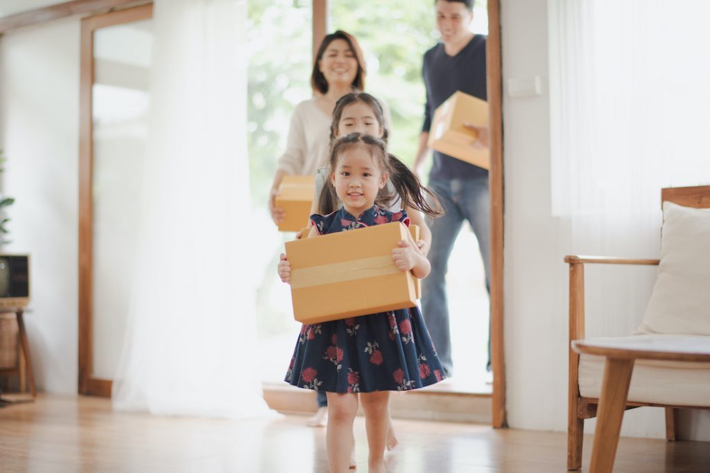 Foster Care, young family moving into new home with Foster Children