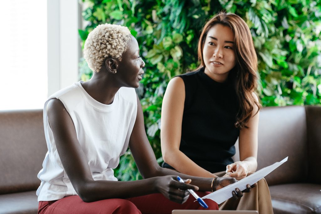 First Aid For Mental Health Level , young woman having discussion with another young woman privately.
