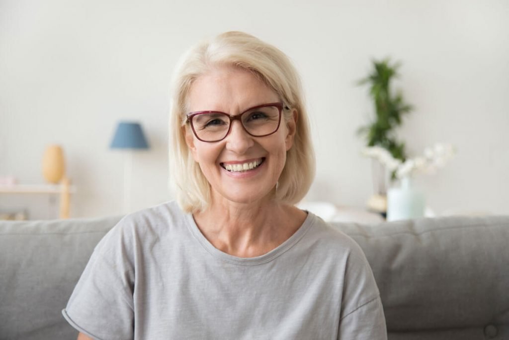 Oral Healthcare, Elderly lady smiling with clean teeth.